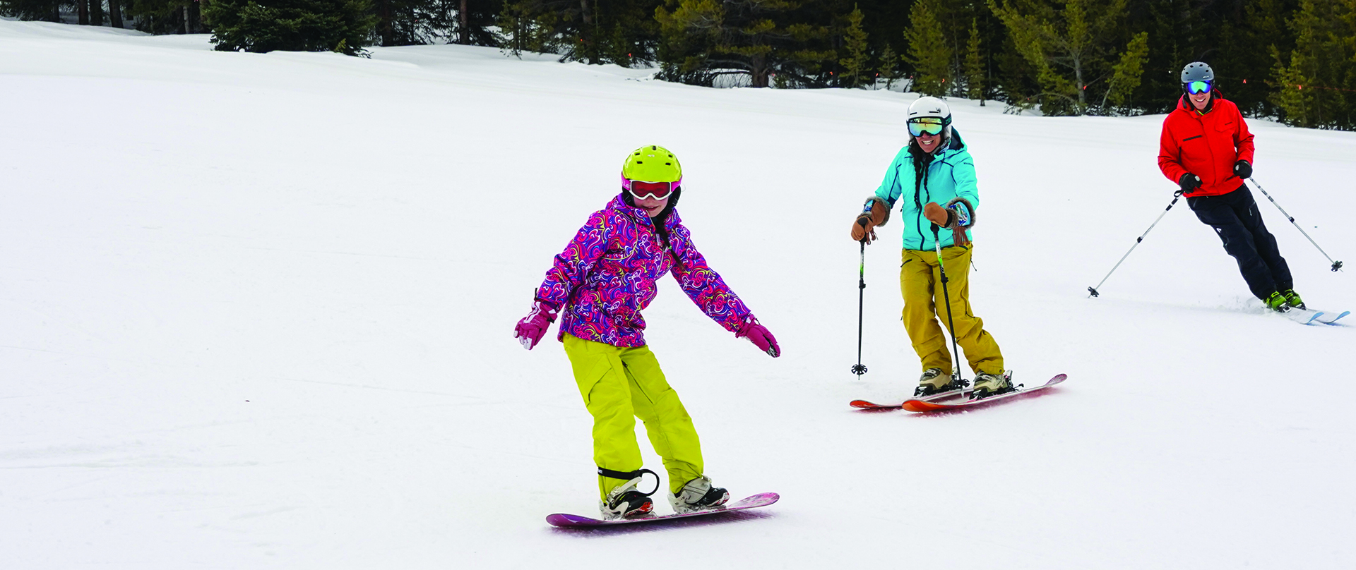 3 people skiing/snowboarding